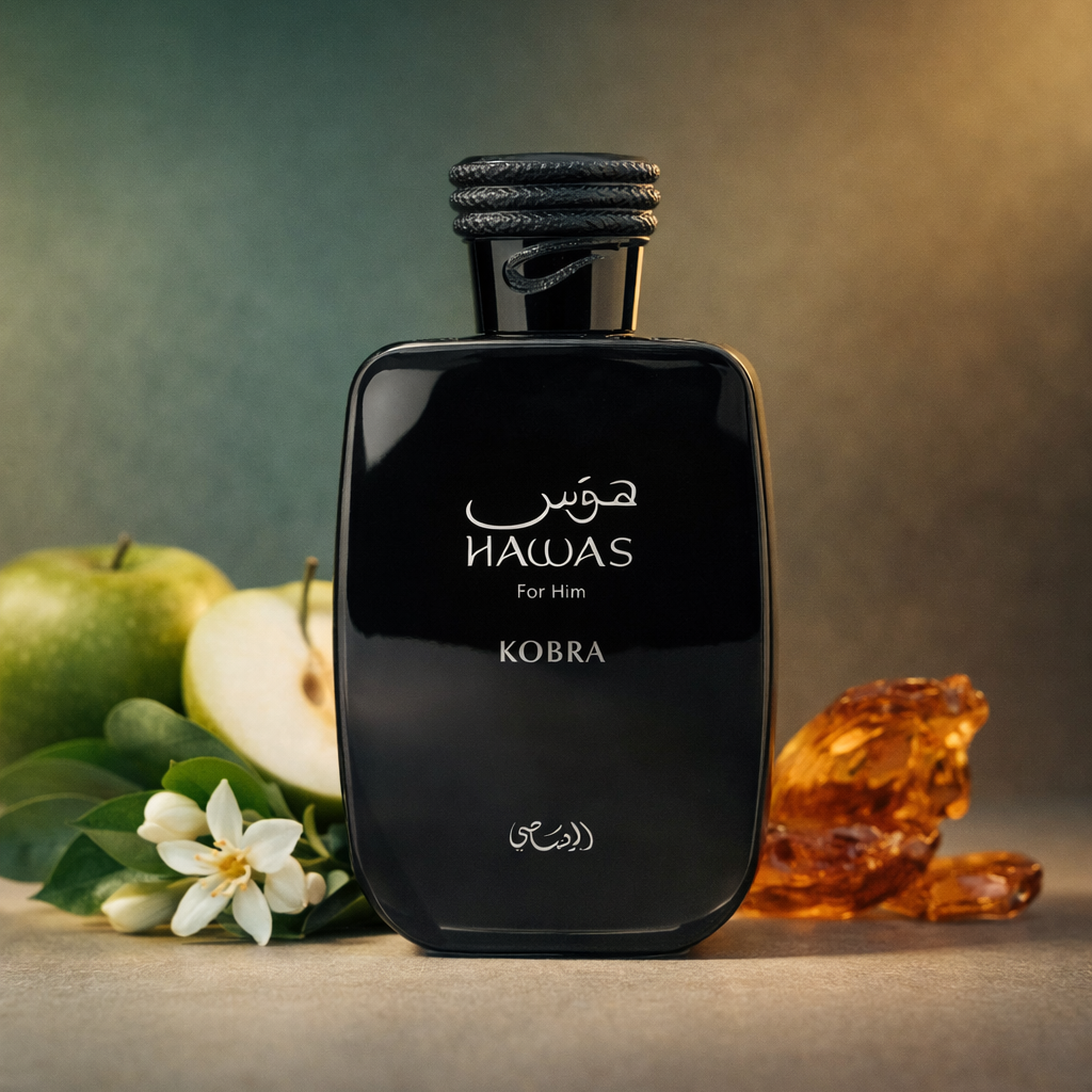 Black Kobra perfume bottle with green apples, a pear, and amber on a gradient background